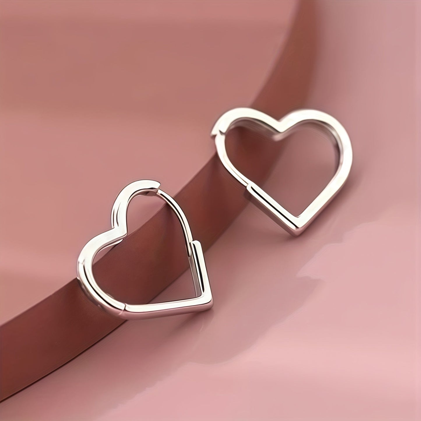 Hjerteformede øreringe i rustfrit stål i guld 